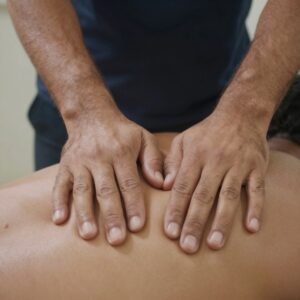 Physiotherapy treatment session showing manual therapy technique for pain relief